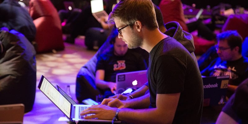 Team in dark room with monitors