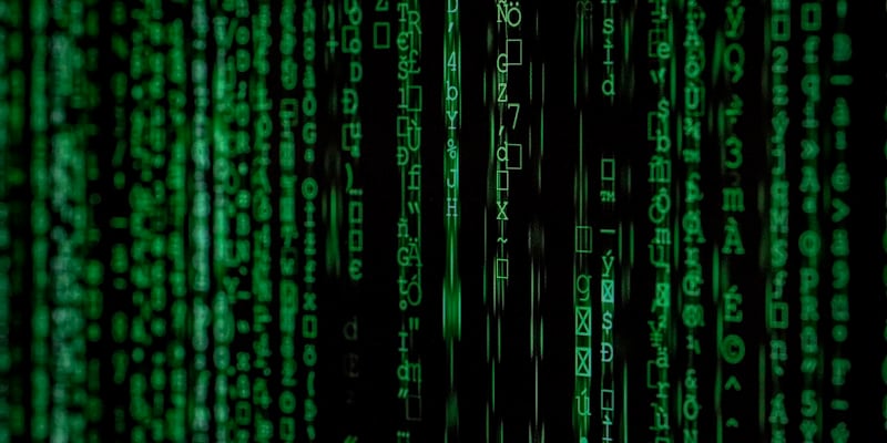 Hacker at computer representing threat actors